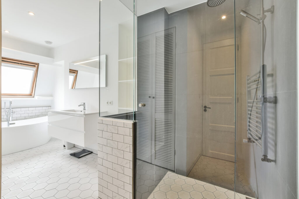 Groves Glass installing a frameless shower door in Port Hadlock WA bathroom